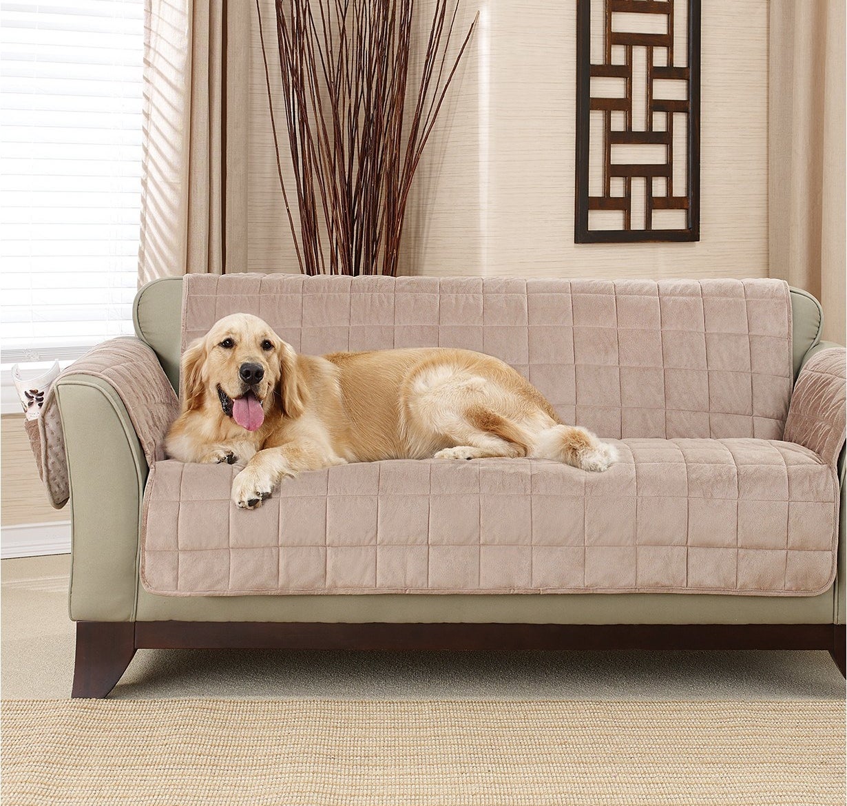 golden retriever laying on a couch with the pet slipcover on it 