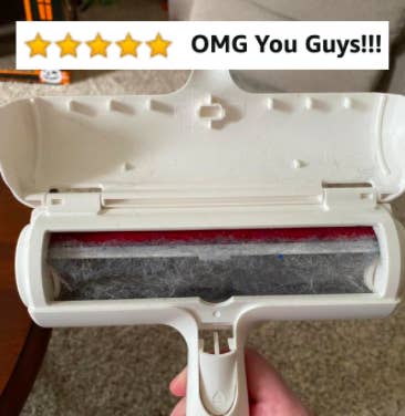 Reviewer holding fur-filled hair-removal tool with five star Amazon caption &quot;OMG you guys!&quot;