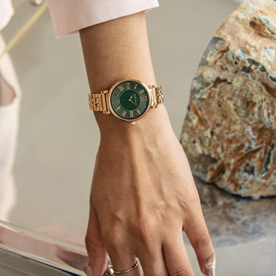 Model in a rose gold anne klein watch