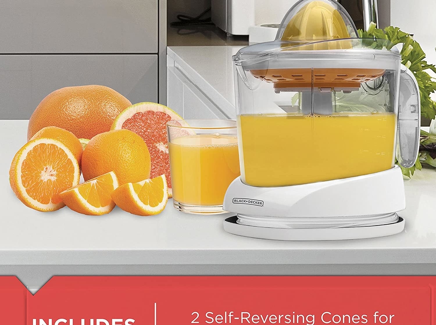 A citrus juicer surrounded by fruit on a kitchen counter