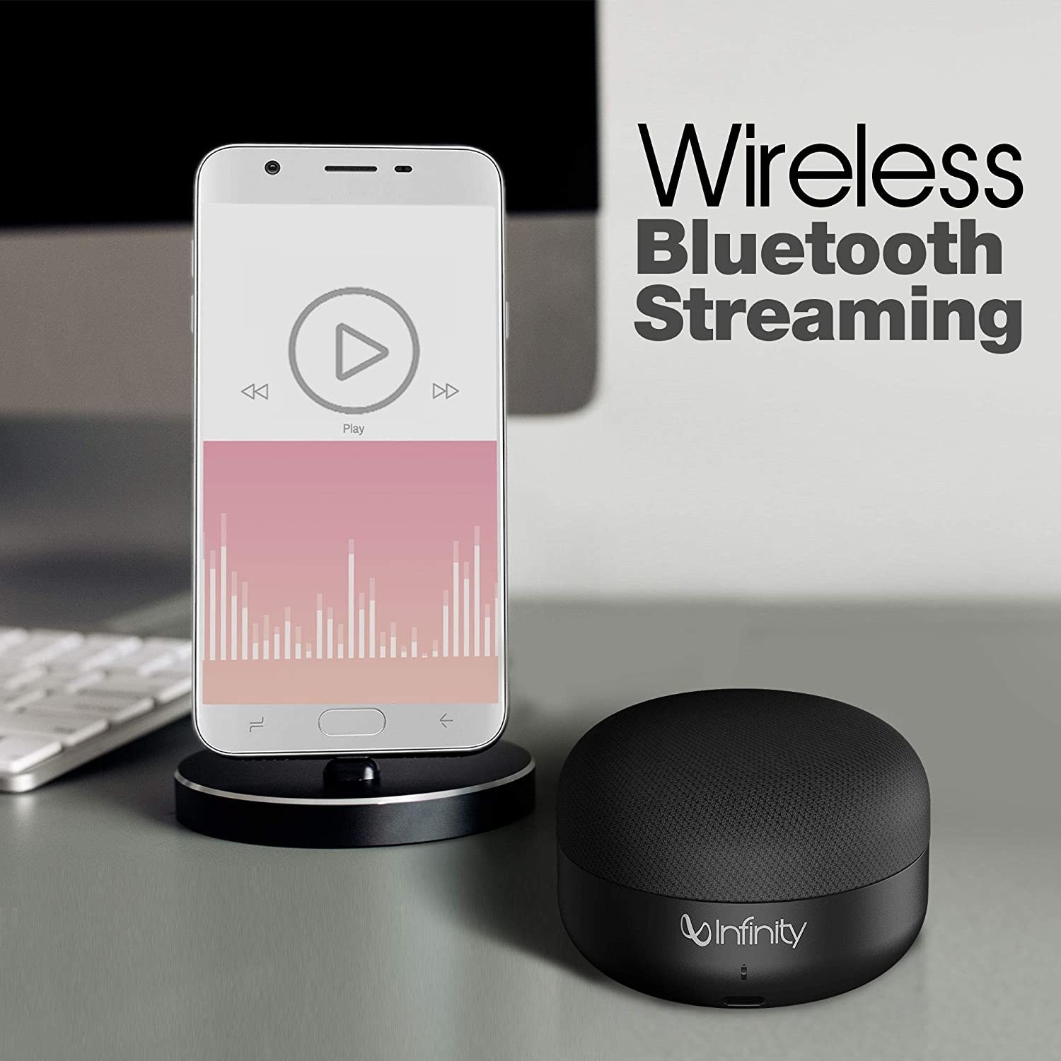 Bluetooth speaker beside a phone, with text above it reading “Wireless Bluetooth Streaming”.