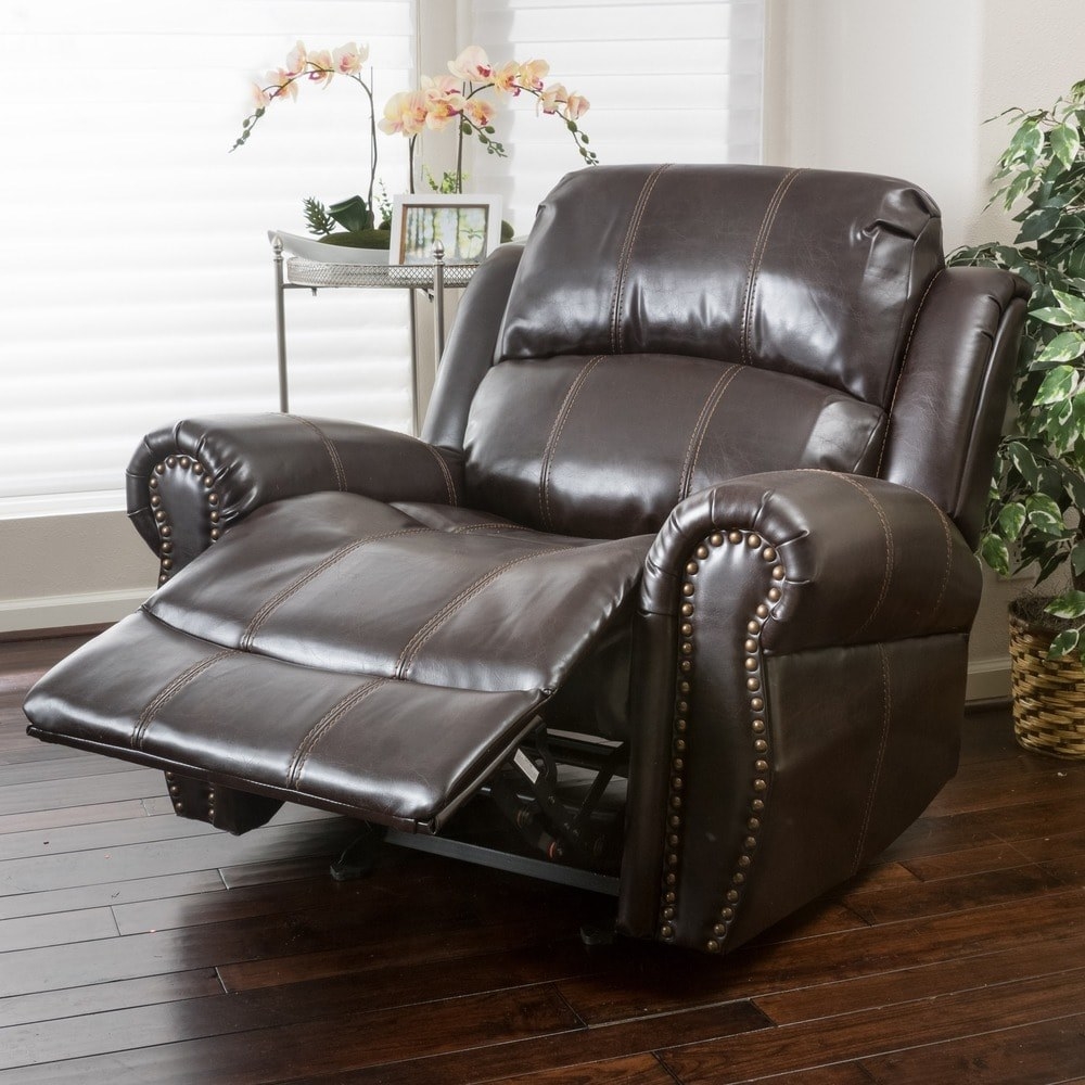 The brown recliner with gold studs