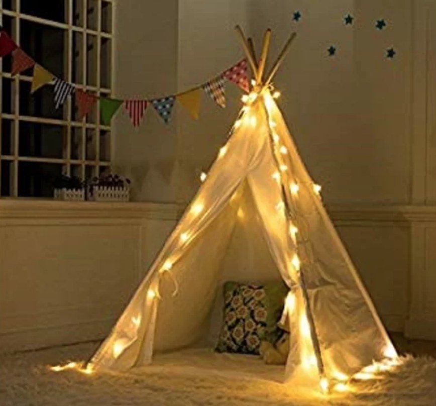 Teepee style white tent with lights