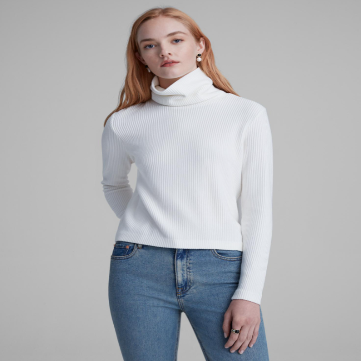 A person wearing a knit turtleneck