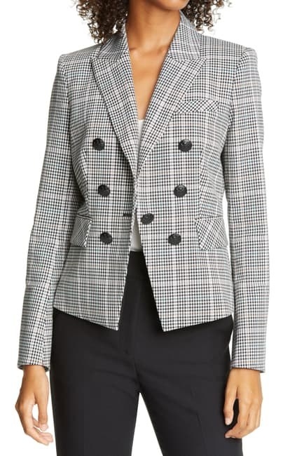 A model wearing the black and gray plaid blazer