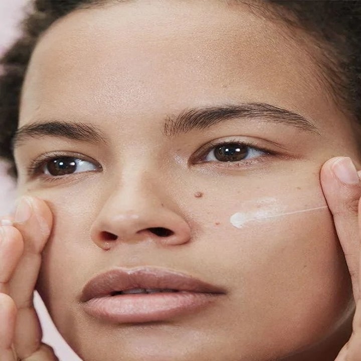 Model with Glossier Primer Moisturizer on their face