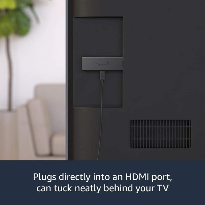 Amazon Fire TV Stick inserted into back of TV