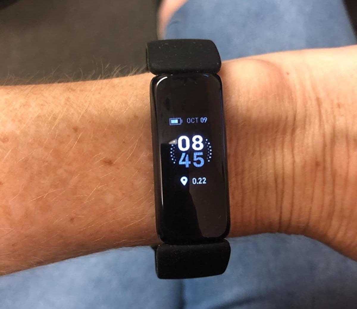 Reviewer wearing Fitbit Inspire 2 fitness tracker on their wrist
