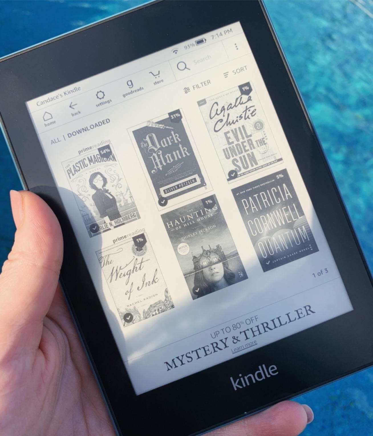 Reviewer holding Kindle Paperwhite