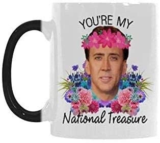 coffee mug with Nic Cage's face on it with flowers and the words 