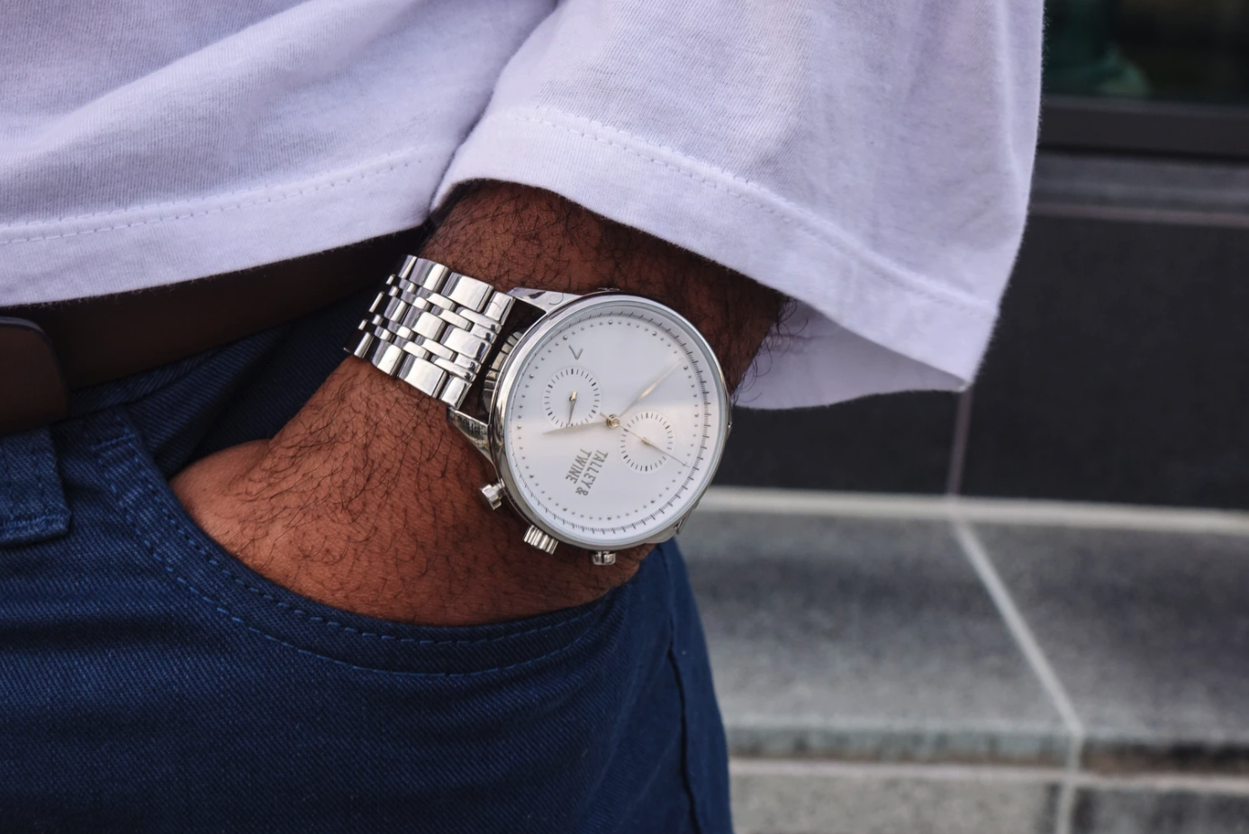 The watch in silver on a wrist 