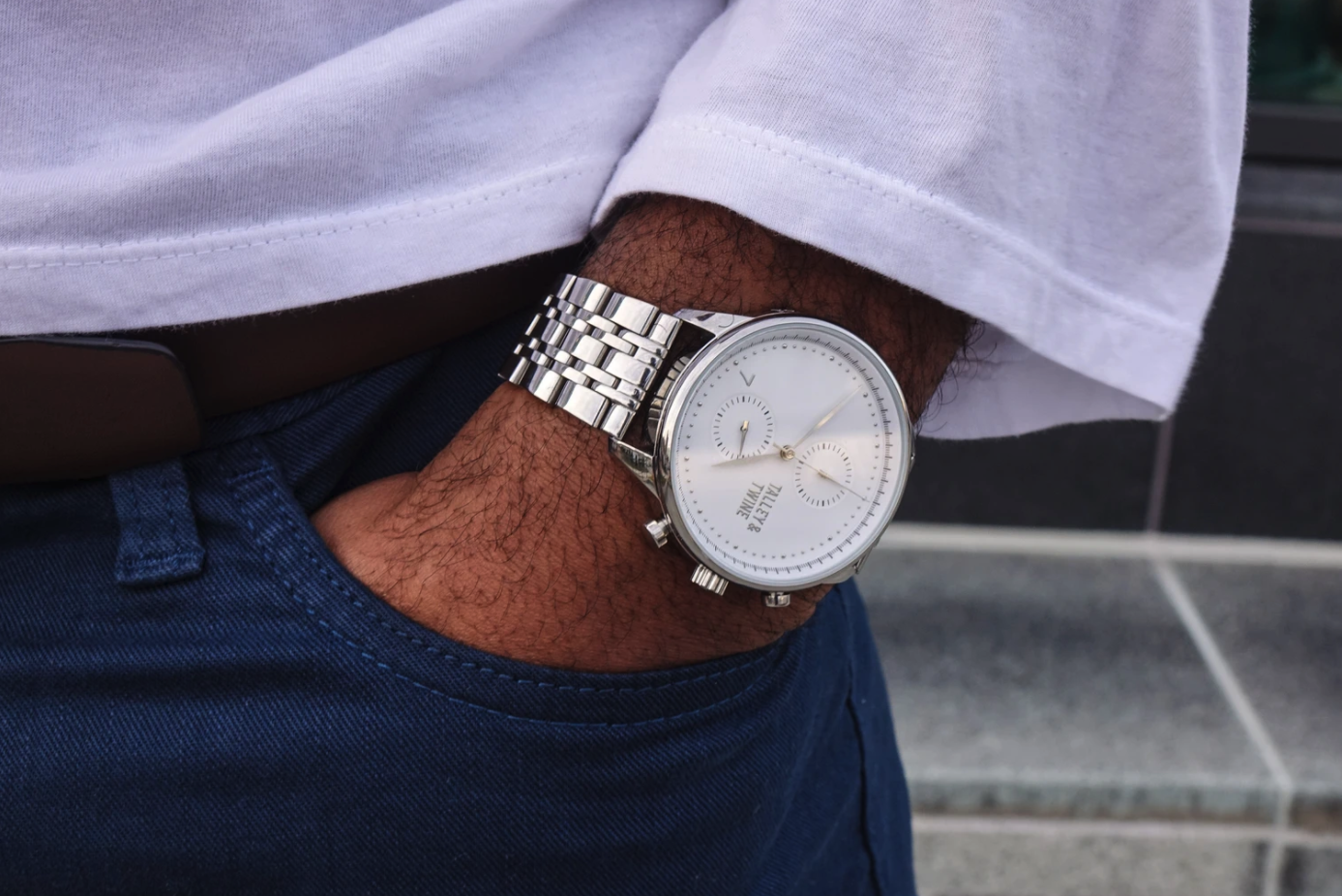 The watch in silver on a wrist