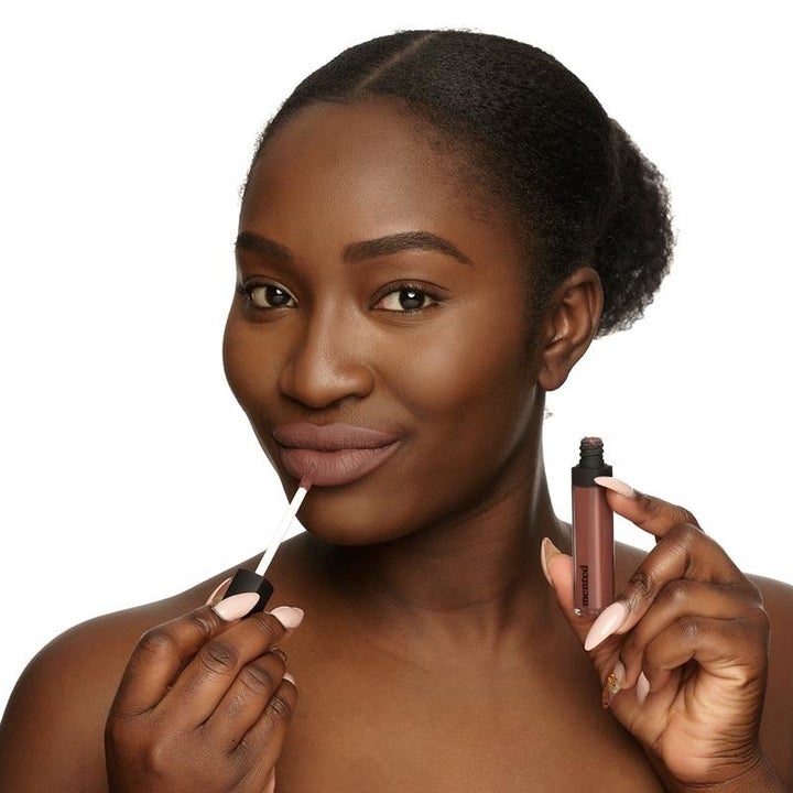 A model applying Liquid Lipstick