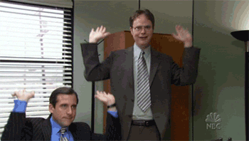 A GIF of two people pumping their hands into the air