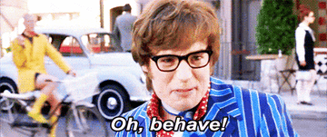 A gif of Austin Powers saying oh, behave