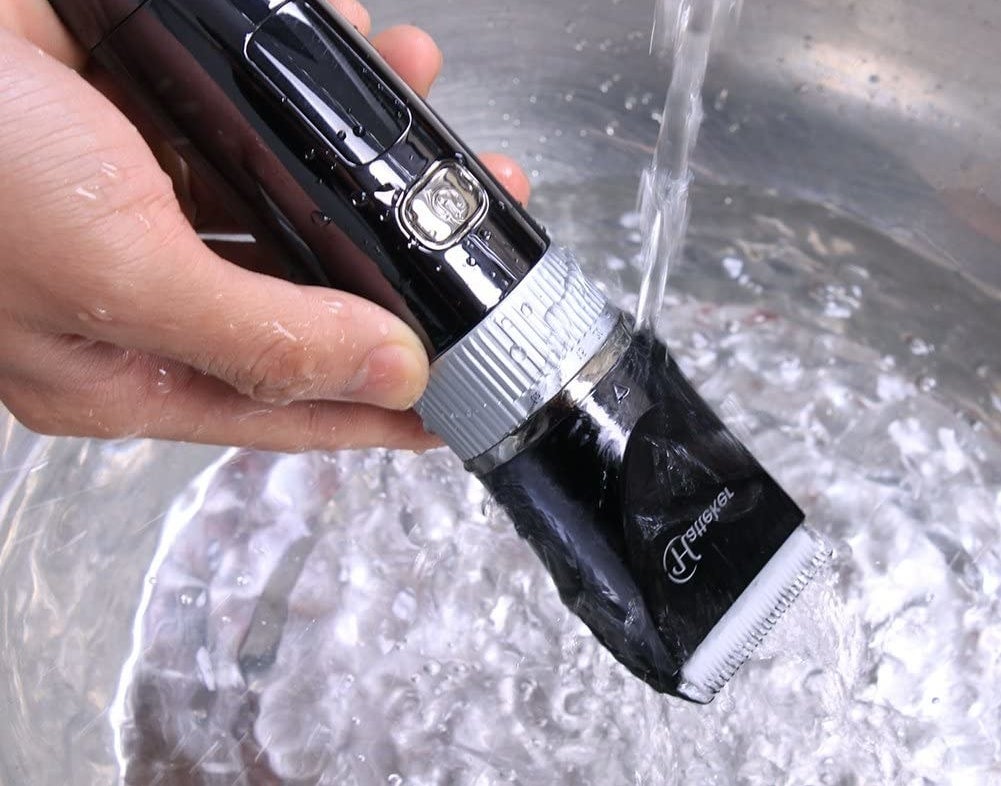 clippers under running water to show they're waterproof