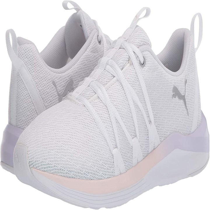 sneakers in white with a pastel pink lining on the sole 