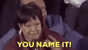 A GIF of a lady on a microphone with the text, You Name It!