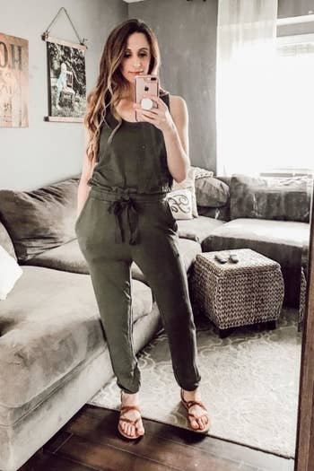 Reviewer wearing the olive jumpsuit