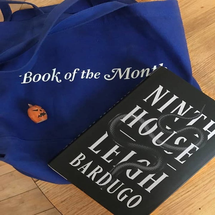 BuzzFeed editor's book of the month tote bag and the book "Ninth House" by Leigh Barugo