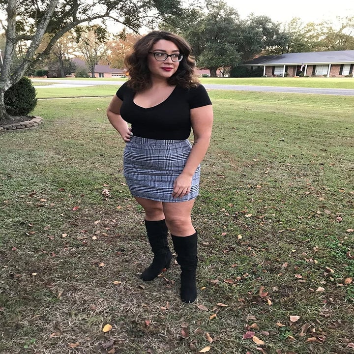 Reviewer wearing the plaid mini skirt in grey and black