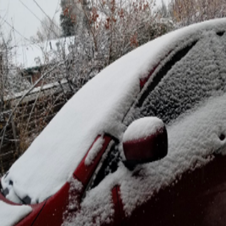Reviewer's windshield covered in snow