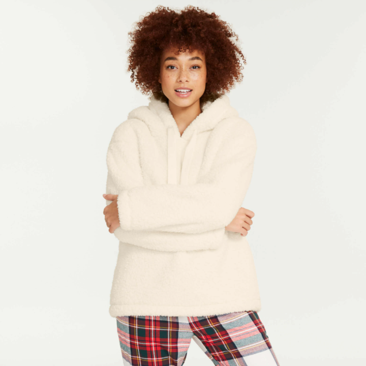 A person wearing a fluffy hoodie