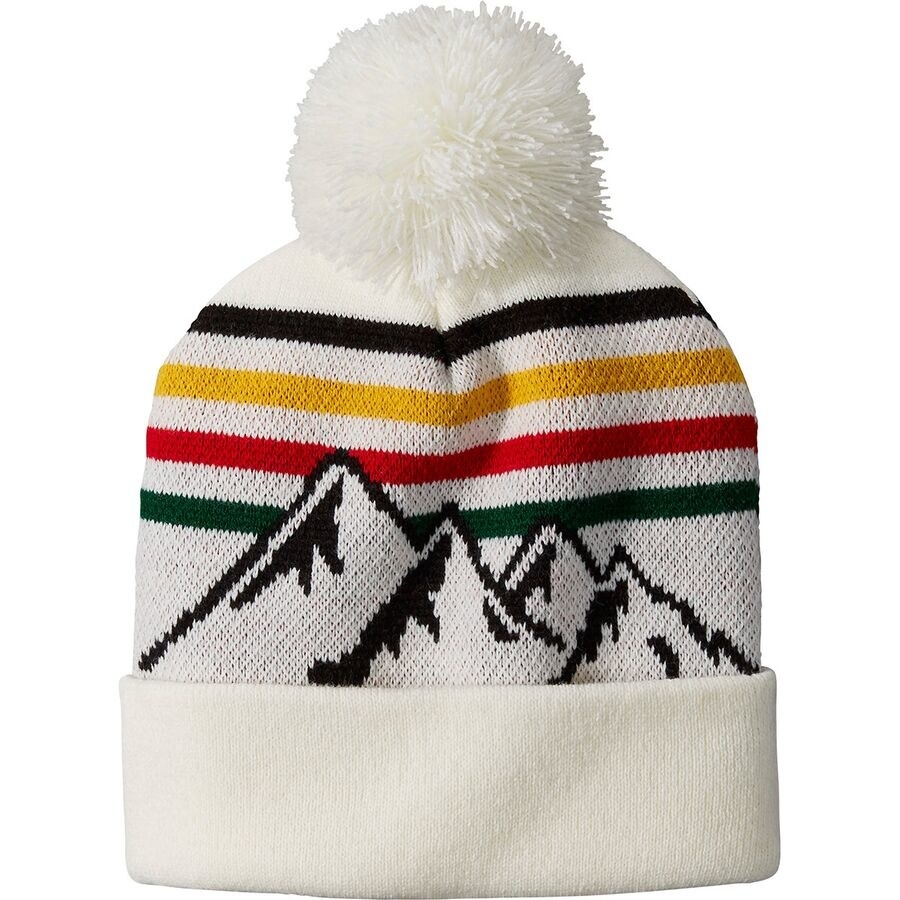 white beanie with a white pom on top with the pendleton stripes and a mountain range