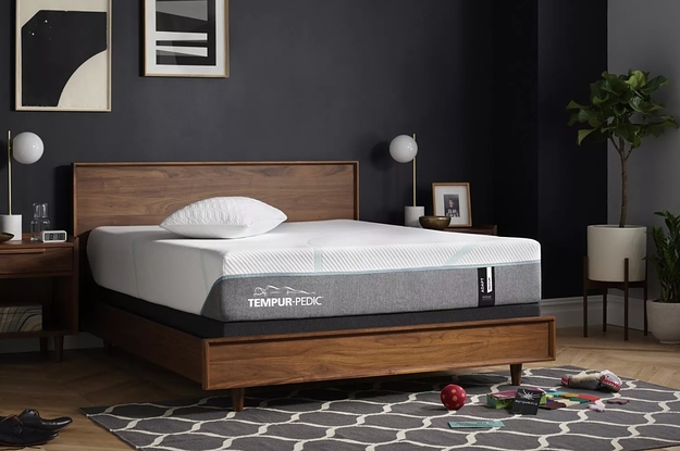 The pressure-relieving king-sized mattress on a wood bed frame