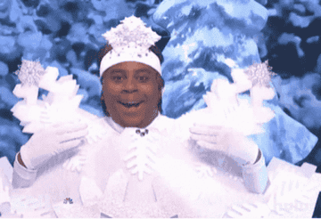 Kenan Thompson dancing in a snowflake costume
