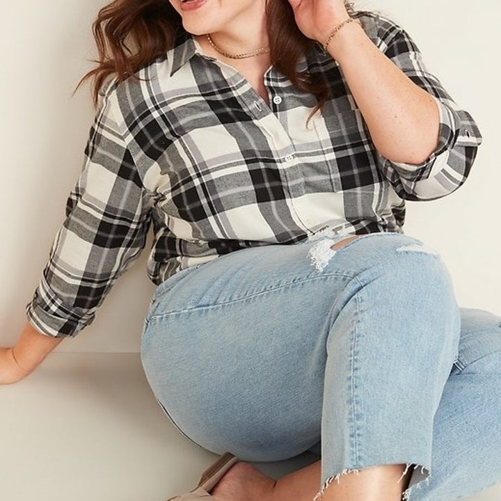 Plus-size model wearing white and gray flannel