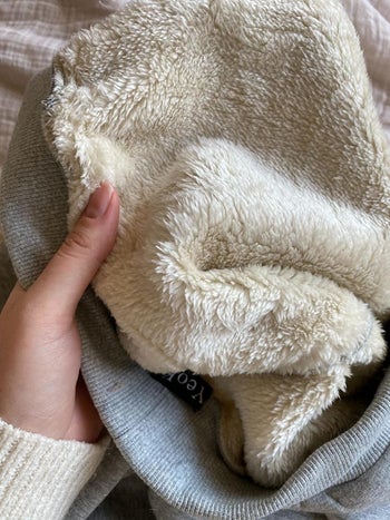 The inside of the joggers: a thick white fleece