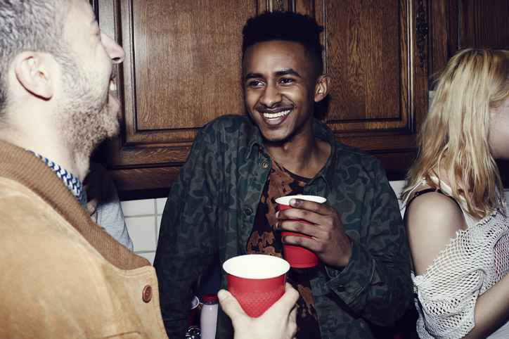 Man drinking from a red cup