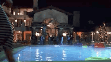 Big party at a mansion house with a pool 