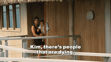 GIF of Kourtney Kardashian holding one of her children with the caption, &#x27;Kim, there&#x27;s people that are dying&#x27;