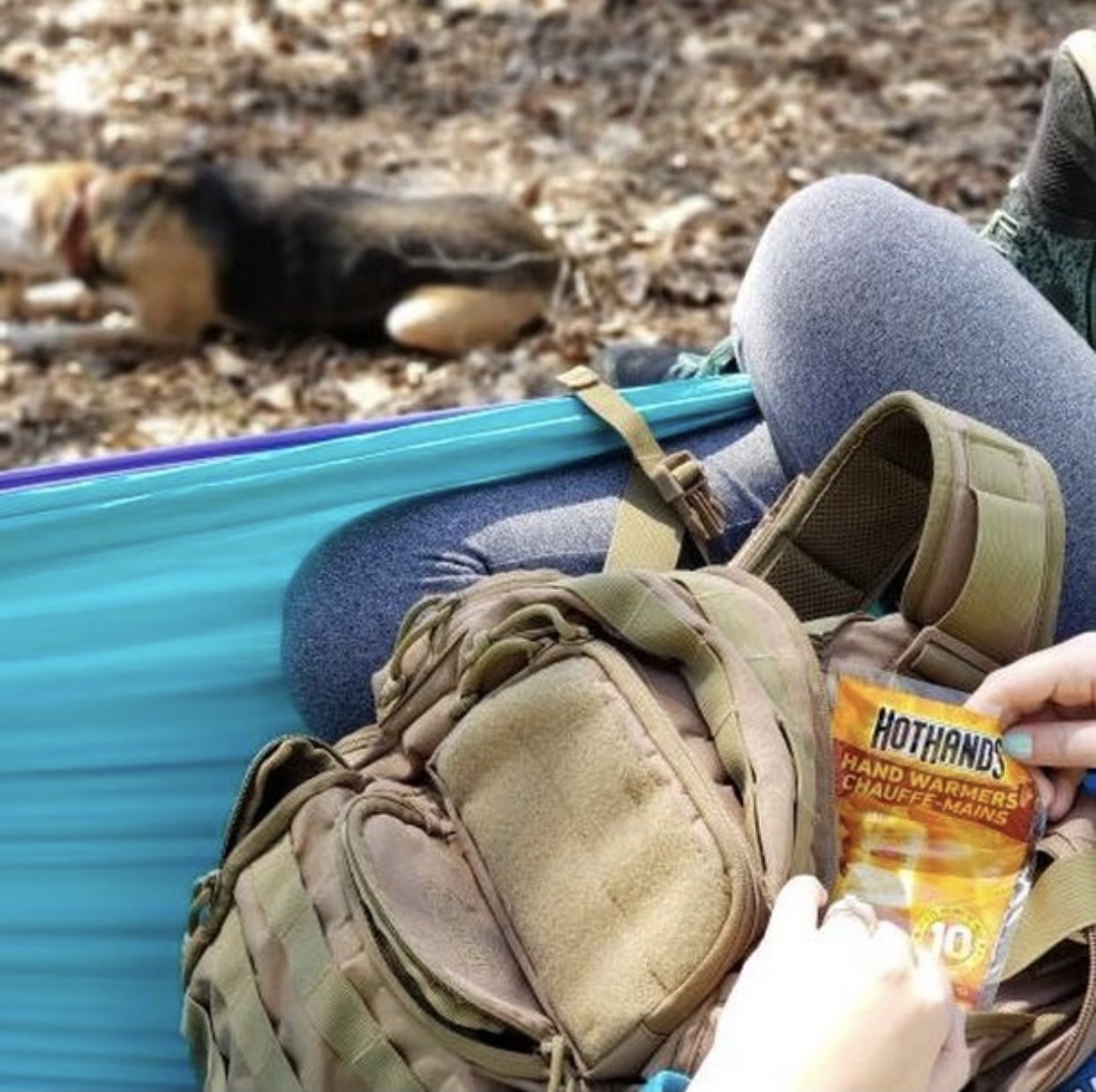 Person is holding a packet of hand warmers