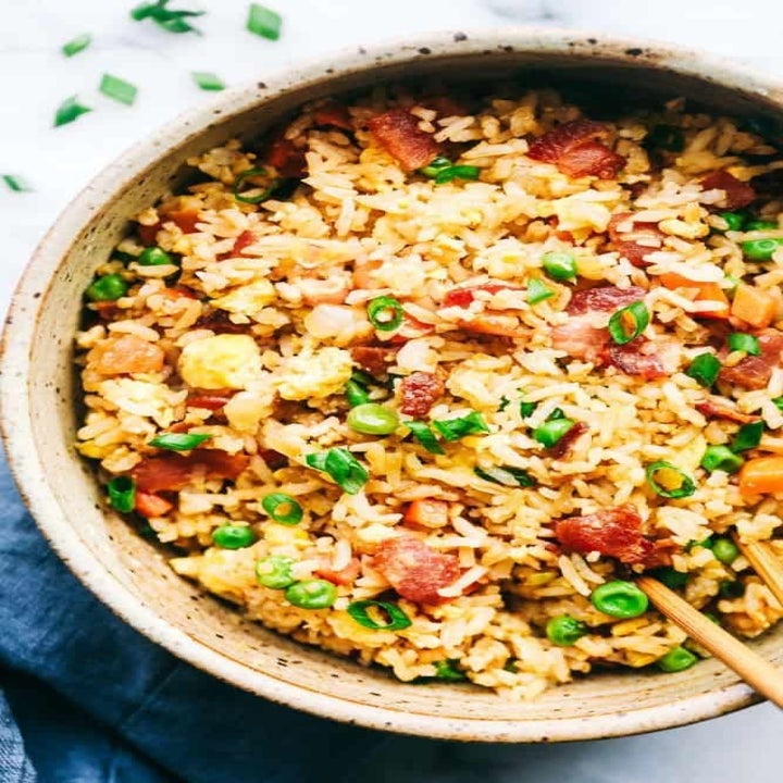 A close-up of bacon fried rice in a bowl.