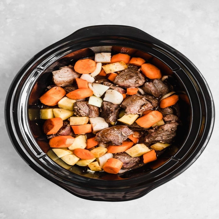 Ingredients for beef stew in a slow cooker.
