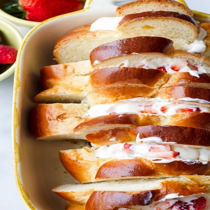 Stuffed challah French toast, uncooked in a baking dish.