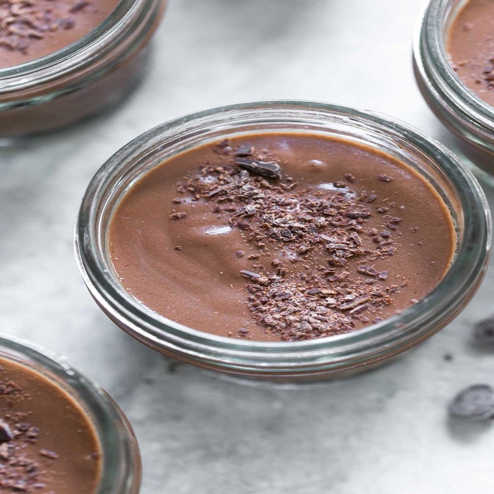 A close-up of creamy chocolate pudding in a ramekin.