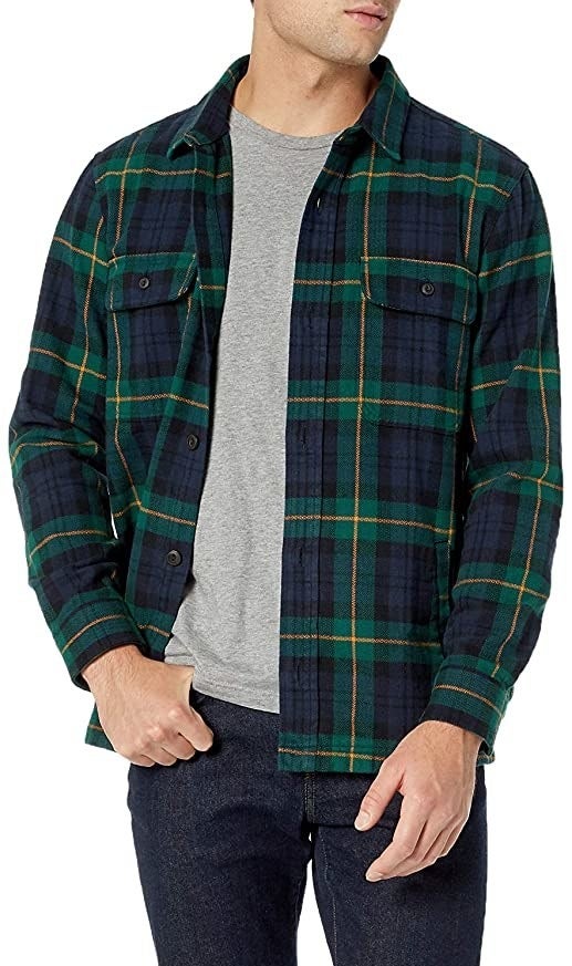 Model wearing green and navy plaid shirt