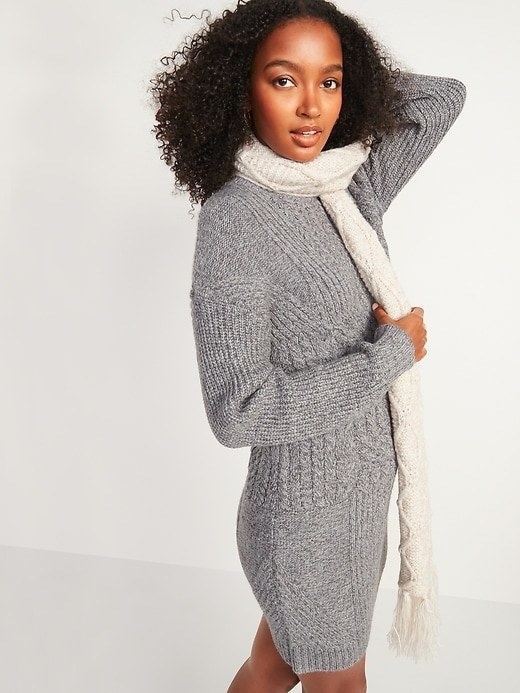 Model wearing grey sweater dress