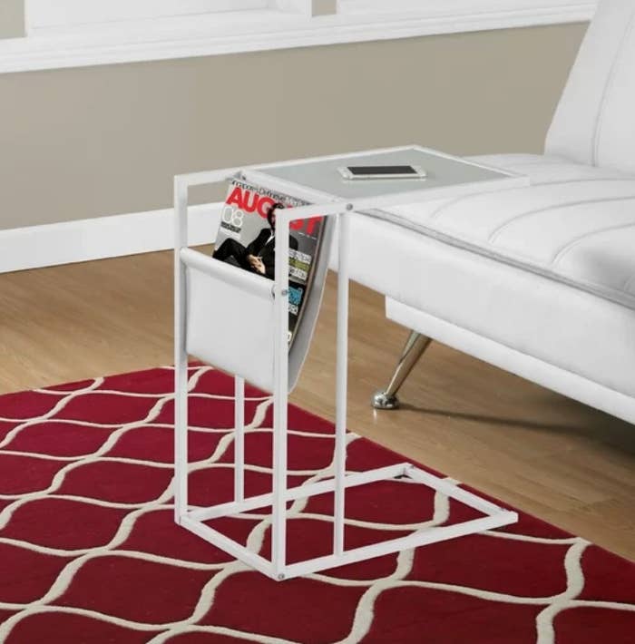 White portable end table with magazine holder and extended frosted glass surface 