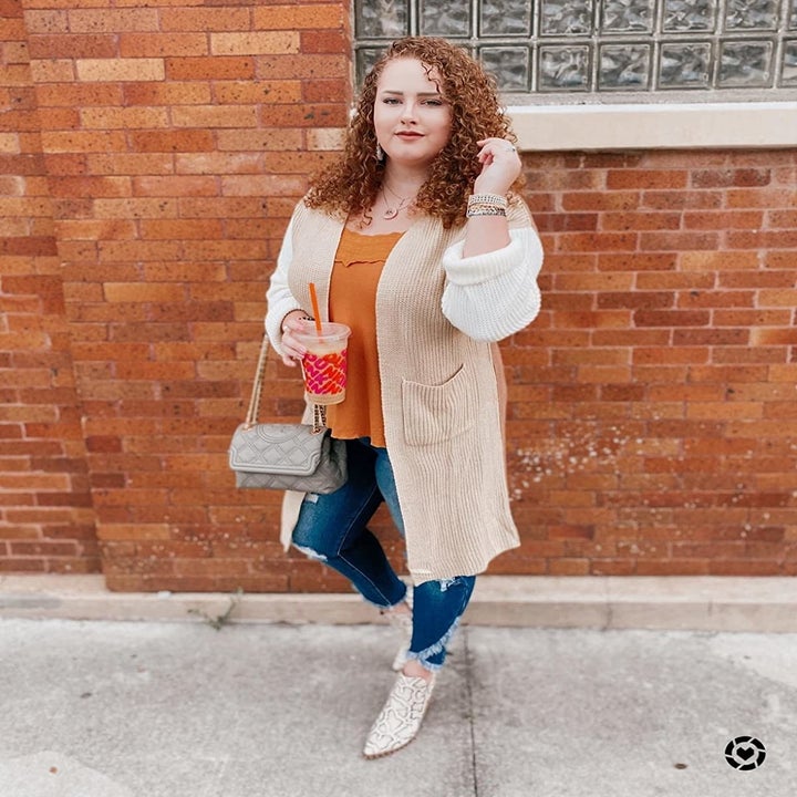 Reviewer wearing the tan cardigan