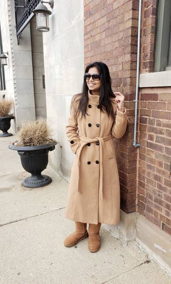 A different reviewer wearing the coat in tan