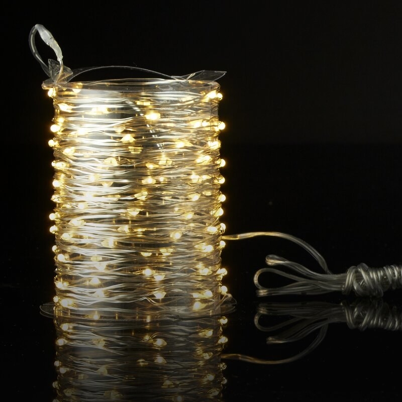a yellow fairy string light wrapped in its original packaging 