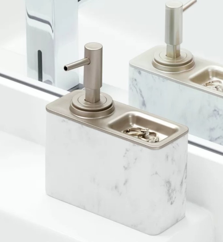 White marble rectangular soap dispenser with chrome spout and tray holding rings 
