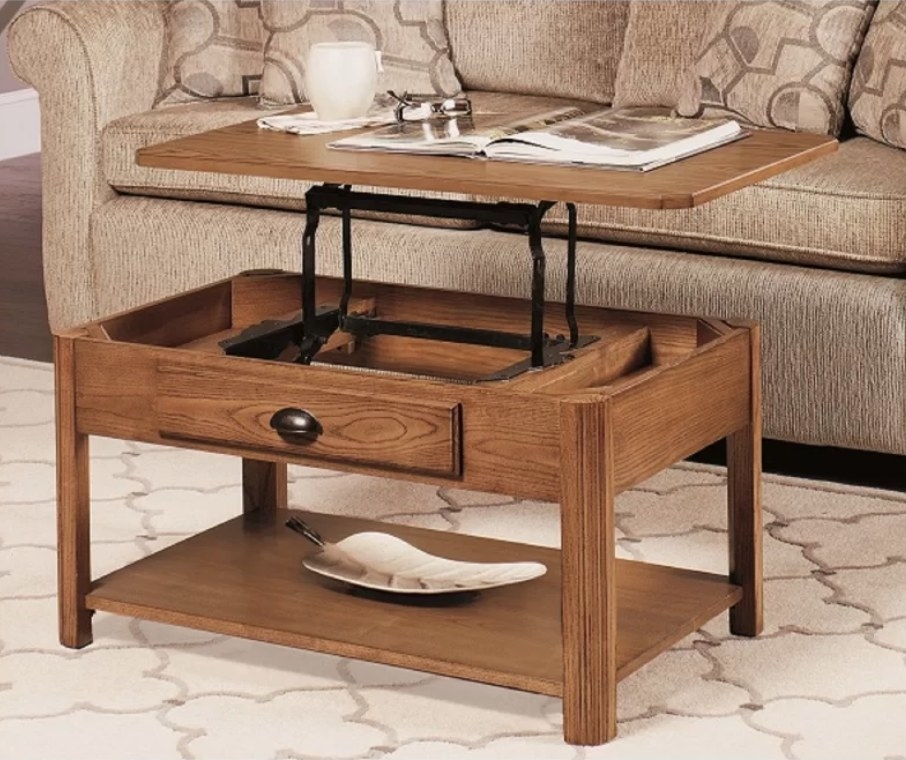 Wooden coffee table with front drawer, and lift up top with storage inside