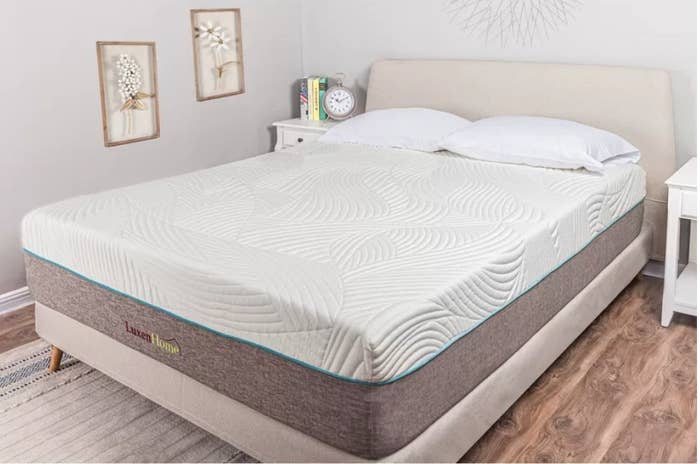 Luxen Home mattress with white gel memory foam top, gray base on top of beige fabric bed frame