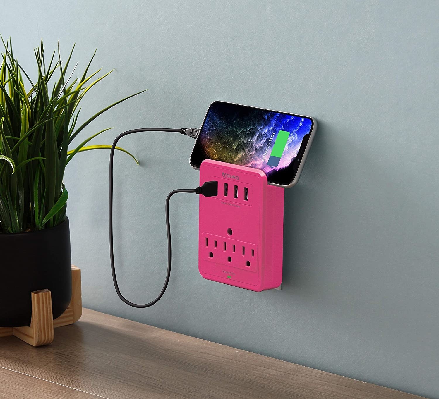 The surge-protecting outlet with a phone plugged into it